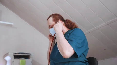 Nurse systematically organizes equipment after consultation. Medical staff Video stock 337548444