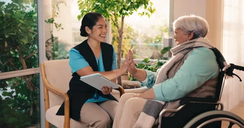 Nurse, tablet and high five with old woman in wheelchair for bonding, elderly Stock Footage 341387832