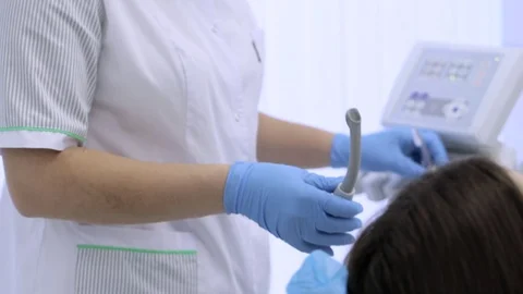 Nurse take off equipment after procedure at dental office Stock Footage