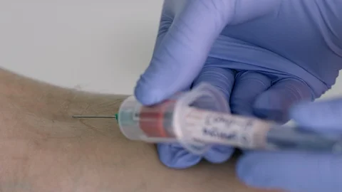 Nurse Taking Blood Sample from Suspected COVID-19 Patient Zero - Part 2 Stock Footage 129821966