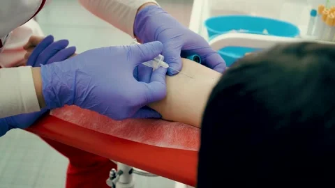 Nurse taking blood sample for testing in tube in health centers laboratories Video stock 152832809