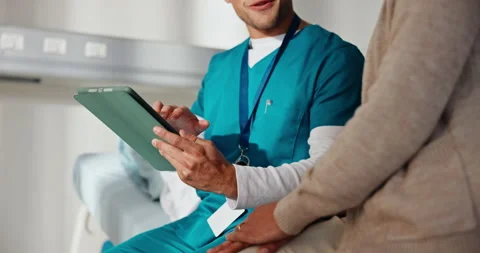 Nurse, talking and hands with tablet in hospital, healthcare and explaining test Stock Footage 341509099