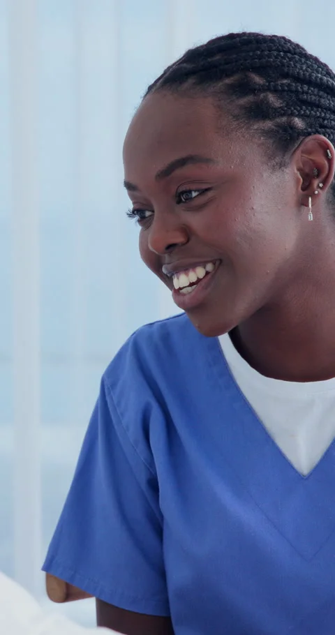 Nurse, talking and help with black woman in hospital for patient checkup Stock Footage 340890192