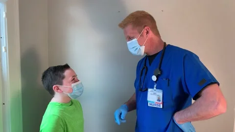 Nurse talking to child Stock Footage 150124655