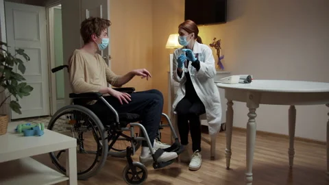 A nurse is talking her patient about vaccine Stock Footage 163310557