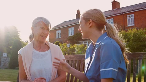Nurse Talking To Senior Woman In Residential Care Home Stock Footage