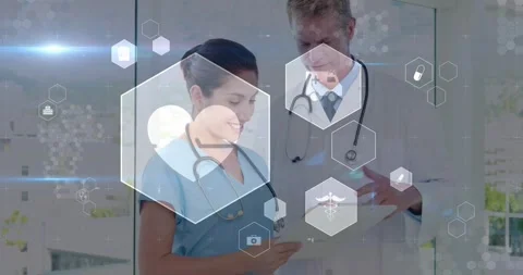 Nurse tapping cell, Dr pointing chart, reviewing medical data for care, hexagons Stock Footage 330380181