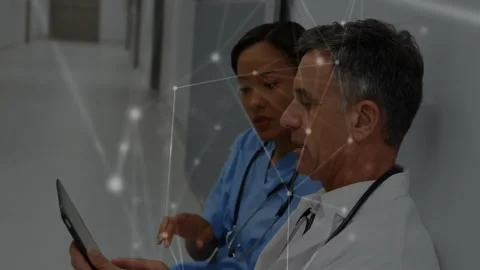 Nurse tapping tablet, doctor browsing data in hospital corridor, animated Stock Footage 312827495
