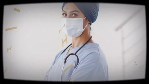 Nurse turning to camera on pullback, gold graphics moving across mask and Video stock 333965589