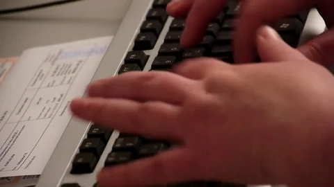 Nurse typing on black keyboard Stock Footage 76950925