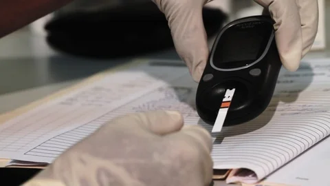 Nurse Using Meter to Test for Diabetes 스톡 동영상 88048038