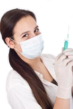 Nurse using a syringe Stock Photos