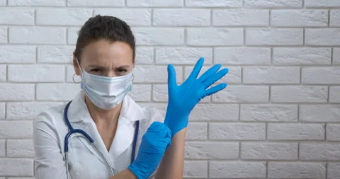 Nurse worker puts gloves. Stock Footage 170878647