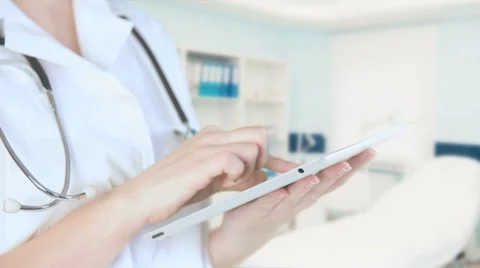 Nurse working in a digital tablet Stock Footage 61512560