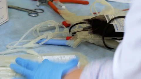 A nurse writes data on empty blood bag sticker Stock Footage 103144865
