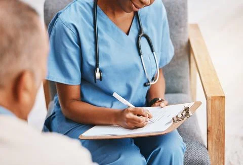 Nurse, writing notes and medical history with patient for healthcare, research Stock Photos