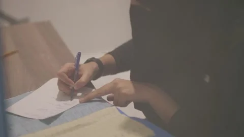 Nurse Writing Notes While Working in a Hospital Setting Stock Footage 309857358