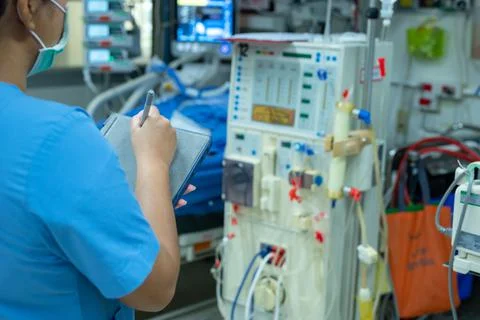 Nurses are checking the function of the hemodialysis machine before use in pa Stock Photos