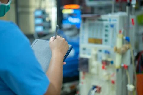 Nurses are checking the function of the hemodialysis machine before use in pa Stock Photos
