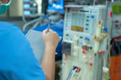 Nurses are checking the function of the hemodialysis machine before use in pa Stock Photos