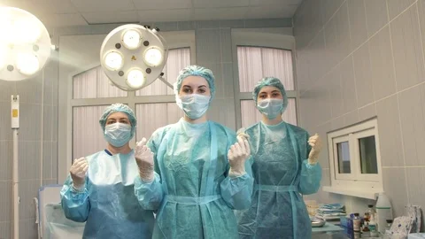 Nurses cross their arms in the operating room Stock Footage 84743817