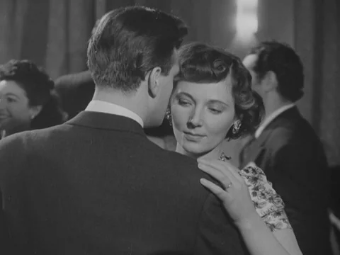 Nurses dancing with men in recreation room, while music is playing, UK 1951 Stock Footage 134030758