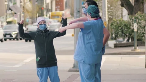 Nurses Doctors Posing Strong in Scrubs During Covid-19 Coronavirus Pandemic Видео 135493021