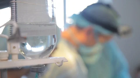 Nurses during surgery. close-up. protective mask. dropper. defocused faces Stock Footage 99197031