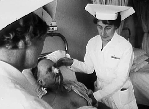 NURSES / ELDERLY MAN IN HOSPITAL, MELBOURNE, AUSTRALIA (1960s) Stock Footage 168656376
