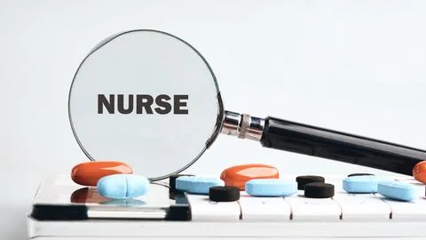 A nurses essentials lay on a clean surface, featuring colorful pills and a Stock Photos