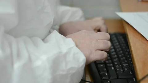 The nurse's hands are typing on the keyboard Stock Footage 182502386