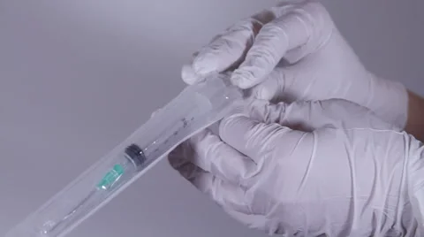 Nurse's Hands Opening Up A Single Use Syringe From It's Package, Sterile, Clinic Stock Footage 46001183