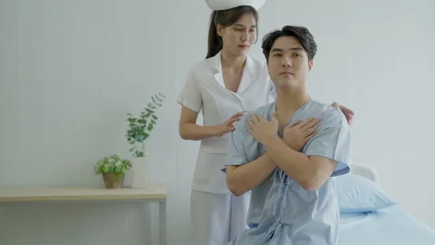 Nurses helping to do physical therapy treatment on body of male patients. Stock Footage 203826965