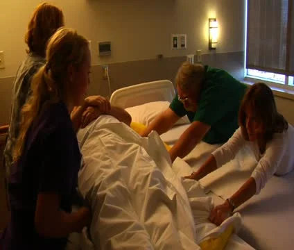 Nurses moving patient from one to another Stock Footage 21598141