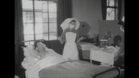 Nurses taking care of patient after surgery, Scotland, United Kingdom, UK, 1948 Stock Footage 134037032