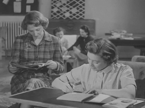 Nurses talking together in resting room, one gets upset and leaves, UK 1951 Stock Footage 134030326