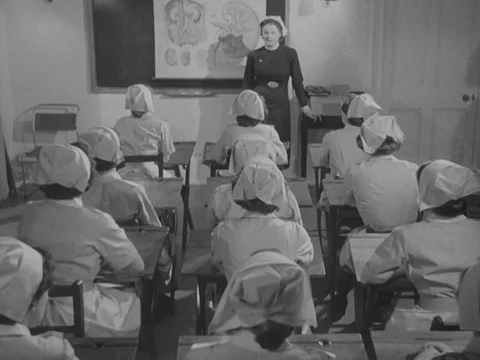 Nurses in training listening to teacher about real life as nurse, UK 1951 Vídeo Stock 134029233