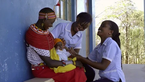 Nurses undertaking an examination, and immunisation of baby, Kenya, Africa. Stock-Footage 76577482