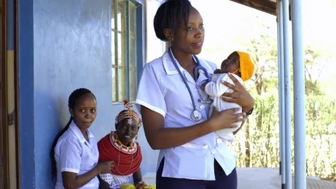 Nurses undertaking an examination, and immunisation of baby, Kenya, Africa. Stock Footage 76580112