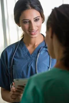 Nurses using tablet computer 스톡 사진