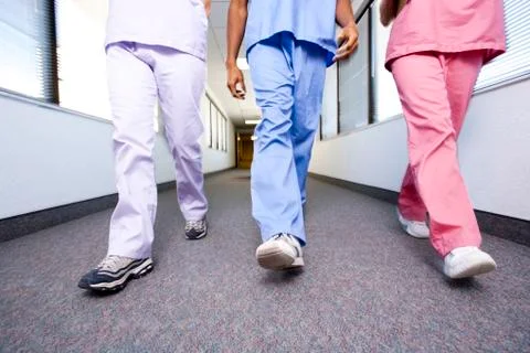 Nurses walking and talking Stock Photos