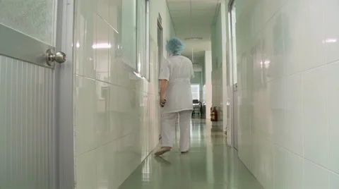 Nurses walking away in hallway Video stock 41579208