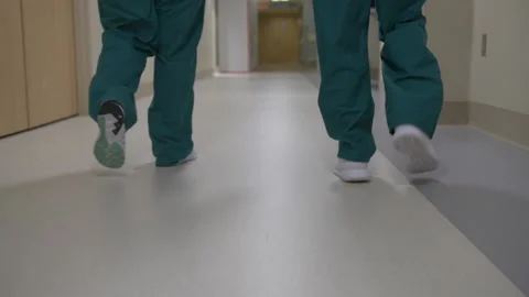 Nurses walking down hallways Видео 145076153