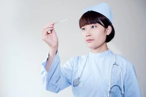 Nurses in watching the thermometer Stock Photos