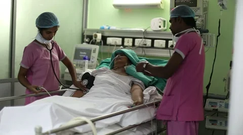 Nurses working with a patient Stock Footage 41417446