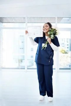 Nursing, celebration and black woman graduate with smile, flowers and ADN Stock Photos