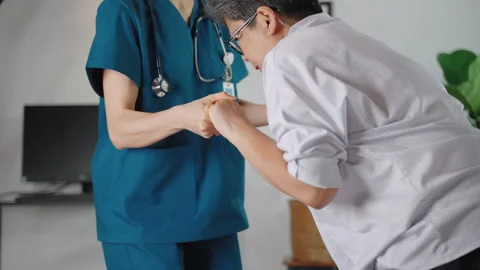Nursing Home is helping elderly people learn to walk using a walker. Stock Footage 276573372