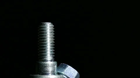 Nut and bolt  rotates  against  dark background. 4K    스톡 동영상 61459367