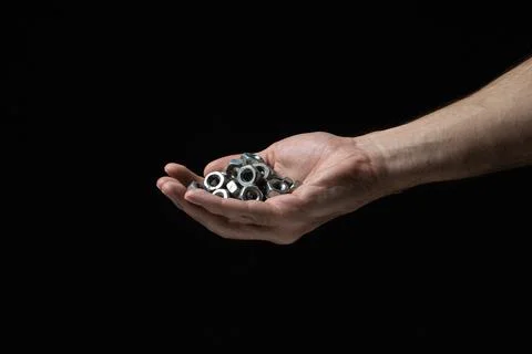 Nut bolts on a black background. threaded fastener.  Stock Photos