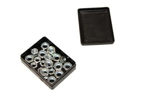 Nut in a box on a white background Stock Photos